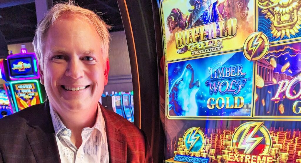 A photo of The Big Payback next to a slot machine.