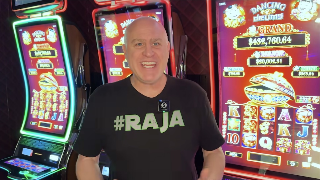 A screenshot of slots influencer The Big Jackpot in front of the Dancing Drums slot machine.